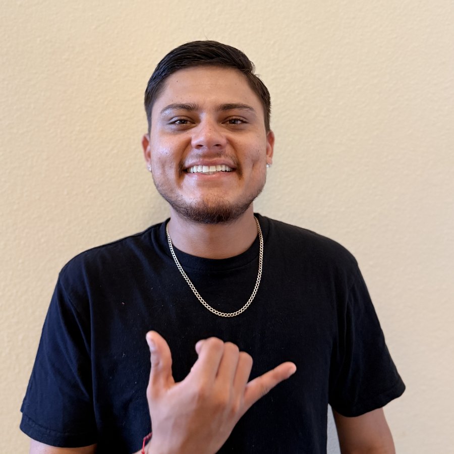 Kevin Villalobos, owner of Everflow Irrigation, giving a shaka